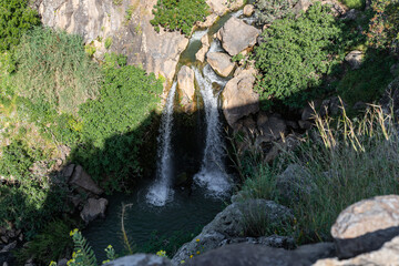Mountain  Saar Falls with cold and crystal clear water descends from a crevice in the mountains of...