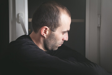Fototapeta premium Caucasian sad and depressed man at home.