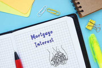 Financial concept about Mortgage Interest with phrase on the piece of paper.