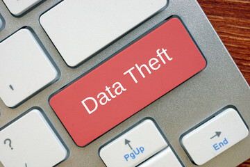 Financial concept meaning Data Theft  with sign on the piece of paper.