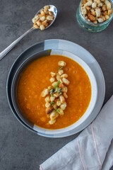 Pumpkin soup. Vegetarian soup in bowl on wooden table