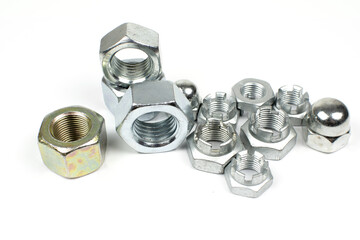 metal nuts of different types on a white background