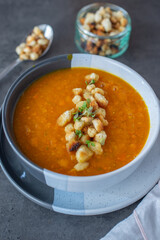 Pumpkin soup. Vegetarian soup in bowl on wooden table