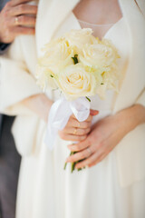 Obraz na płótnie Canvas Wedding bouquet. A bouquet of roses. The girl holds a bouquet. Bride with a bouquet. Romance. Wedding.