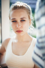 Portrait of a beautiful girl. Natural beauty. A woman of Slavic appearance. A girl with blue eyes and full lips.