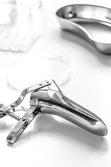 instruments of gynecologist on white background