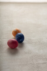 Painted Easter eggs on light concrete