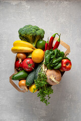 Eco-friendly paper bag on gray concrete