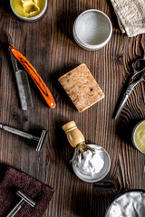 Tools for shaving in barbershop on workplace background top view