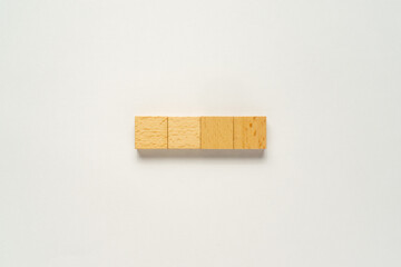 A wooden block with a copy space on a white background. Flat lay view concept.