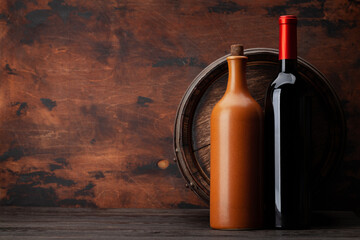 Wine bottles and old wooden barrel