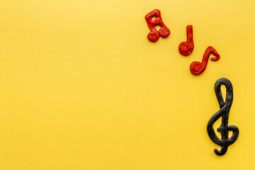 Top view of music notes made of rubber. Music abstract background