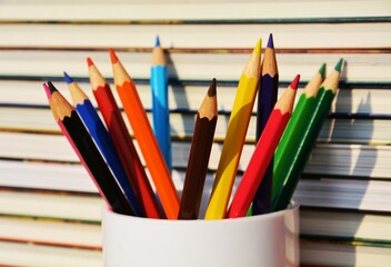 Crayon, pencils in a glass, education, school object, concept