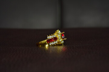 Gold ring with garnet and diamond
