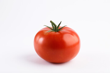 Red round tomato on white background