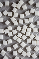 Organic White Sugar Cubes on cloth, top view. Flat lay, overhead, from above.