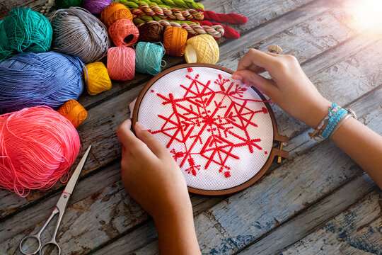 Making embroidery canvas on the table. Hand made concept with etamine