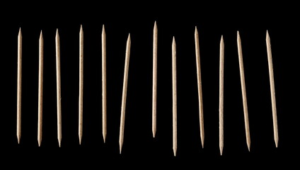 Wooden toothpick set and collection isolated on black background