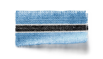 Botswana flag on a piece of cloth on a white background