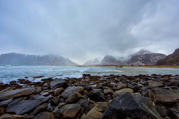 Beautiful landscape. Lofoten Islands. Stones against the backdrop of mountains and clouds.