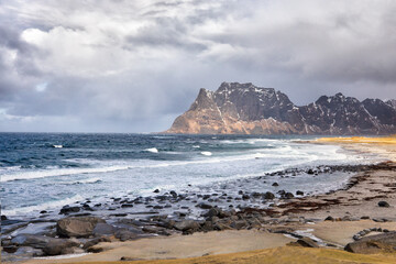 Fototapeta na wymiar Lofoten islands. Beautiful landscape. Stones and mountains on the background of white clouds.