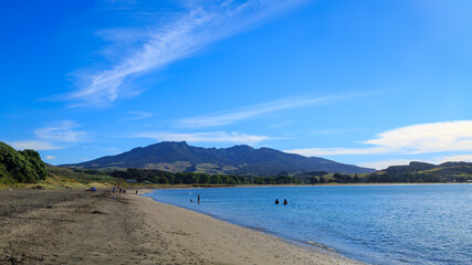 The black sand beach at Raglan, New Zealand, with Mount Karioi on the horizon