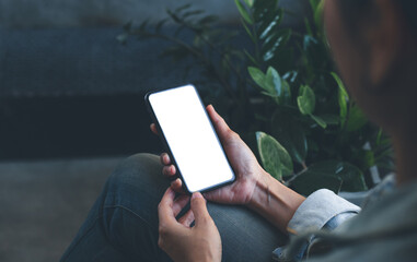 cell phone blank white screen mockup.woman hand holding texting using mobile on desk at office.background empty space for advertise.work people contact marketing business,technology