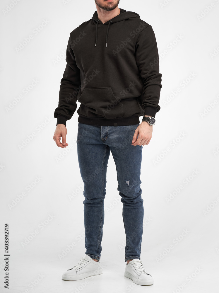 Wall mural man wears black hoodie. isolated clothing mockup photo