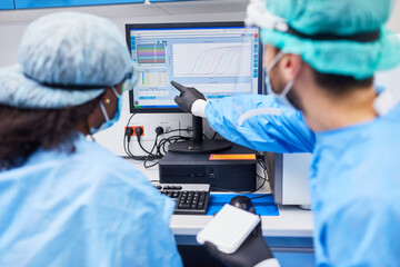 Researcher evaluating experiment on the computer