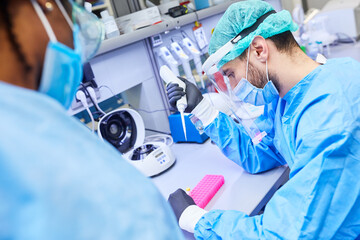 Biotechnology researchers work together in the laboratory