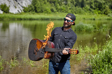 Tourist left guitar near bonfire and it caught fire.