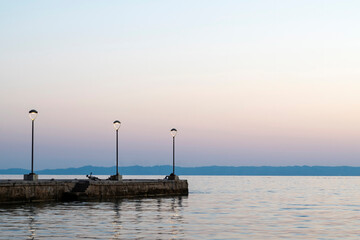 Fototapeta na wymiar Pier at sunset in Greece