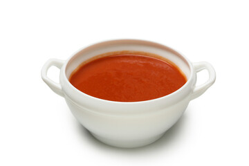 Bowl of tomato soup isolated on white background