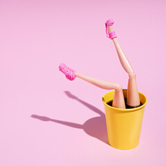 Coffee cup pattern with female doll legs and high heels on pink background. Minimal coffee shop...
