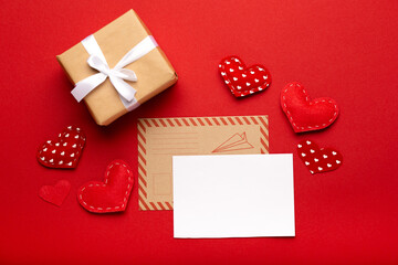 Concept of Valentine's Day love letter on red background top view