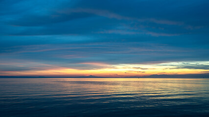 Fototapeta na wymiar Sunset on the Aegean sea coast in Greece