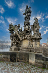 Fototapeta na wymiar Statue on the famous Charles bridge in Prague, Czech republic