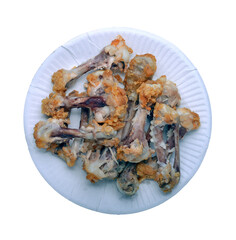 Chicken bones in a paper plate