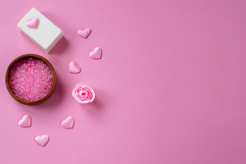 Natural spa set with salt and soap on a pink background. Valentine's day, birthday, mother's day, 8 March. Top view, flat lay.