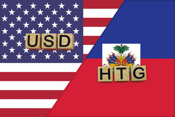 USA and Haiti currencies codes on national flags background