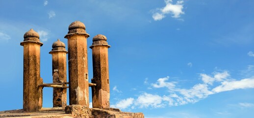 Old ruined historic pillars of a vintage Indian well