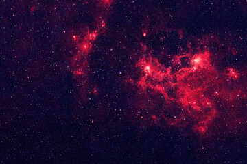 A bright, red galaxy. Elements of this image were furnished by NASA.