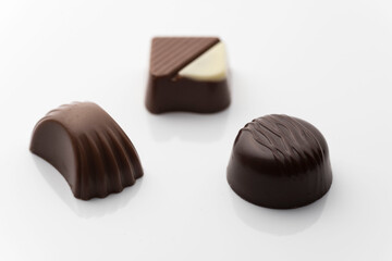 Closeup shot of tasty chocolate candies on white background