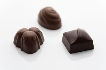 Closeup shot of tasty chocolate candies on white background