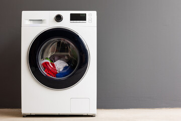 Washing machines and colorful fabrics The washing machine is running set in the house.