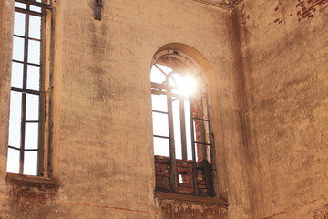 Detail of abandoned church interior, sun in window