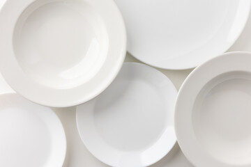 Several white plates arranged in a beautiful frame. There is a blank space to enter text.