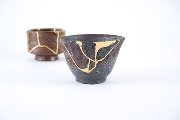 Antique small kintsugi sake cups, real gold restoration closeup
