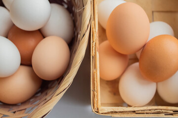 Chicken eggs in braided baskets round and rectangular shapes