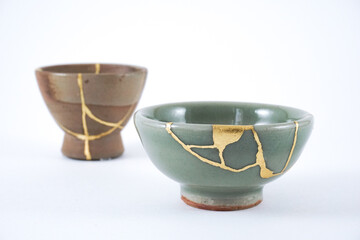 Kintsugi detail closeup, real gold wabi sabi Kintsukuroi, Japanese artisan work. Kintsugi, the beauty of imperfections.